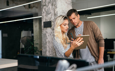 Business solutions, technology and strategy concept. Colleagues working and brainstorming in office