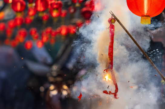 Traditional Chinese firecrackers are exploding with flashes and smoke in Lunar new year.