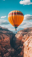 Obraz premium Hot Air Balloon Rising Over Scenic Valley Landscape