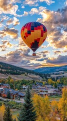 Fototapeta premium Brightly Colored Hot Air Balloon Drifting in Sky
