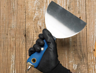 Stainless Steel Trowel with a Black Handle specifically designed for Home Improvement tasks