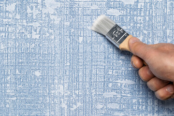 HandPainting a Beautifully Textured Blue Wallpaper Using a Brush for Adding Charm