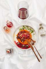 Duck Confit with Carrot Cream, Cranberry Sauce, and Hazelnut Praline