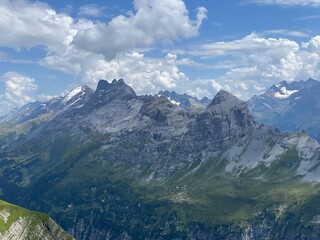 Naklejka premium View of the Urner Alpen from the peaks above Lake Melchsee or Melch Lake in the Uri Alps mountain massif, Kerns - Canton of Obwald, Switzerland (Kanton Obwalden, Schweiz)
