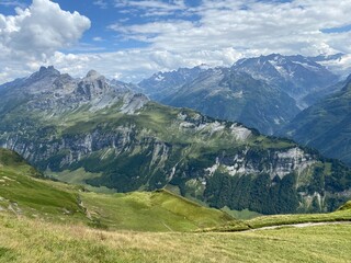 Fototapeta premium View of the Urner Alpen from the peaks above Lake Melchsee or Melch Lake in the Uri Alps mountain massif, Kerns - Canton of Obwald, Switzerland (Kanton Obwalden, Schweiz)