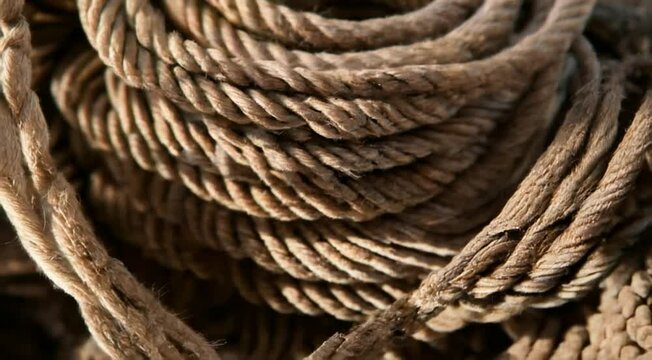 A close-up shot of the round bundle of brown rope