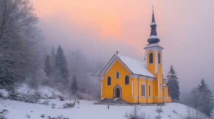 A serene yellow church stands amidst a snowy landscape at dawn, surrounded by trees and mist.