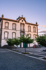 Fototapeta premium Cobbled yard with trees and facade of town hall of Vila Franca do Campo, São Miguel - Azores PORTUGAL