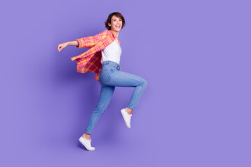 Full size profile photo of nice young girl run empty space wear shirt isolated on violet color background