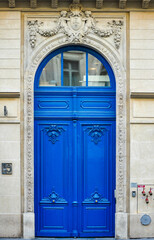 Parisian Craftsmanship: The Refined Elegance of Urban Wooden Doors (in blue color), France, Europe