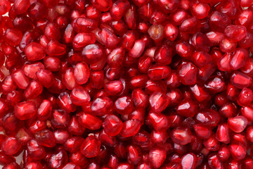 Vibrant Close-Up of Fresh Pomegranate Seeds Displaying Their Juicy Red Texture