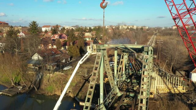 Aerial view on worker as they cutting waste metal of bridge by mixing oxygen and acetylene gas, propane