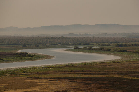 A river winding through a flat terrain.