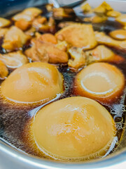 Egg and pork in sweet brown sauce.
