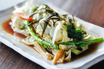 stir fried vegetable or stir fried cabbage , broccoli and baby corn with seaweed