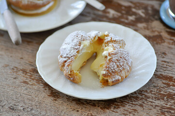 choux cream or cream puff, eclair in a small dish