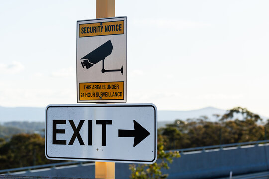 Security notice this area is under surveillance and exit sign