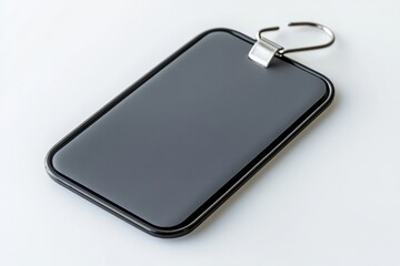 Rectangular gray badge with metallic safety pin and sleek design isolated on a white background, ideal for branding, identification, and promotional materials