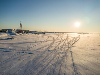 The winter aerial view of Pechora river, with snowmobile trails, and winter December landscape in...