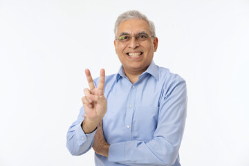 Photo portrait of handsome retired man show v sign