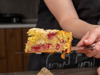 a piece of pie is held by a hand