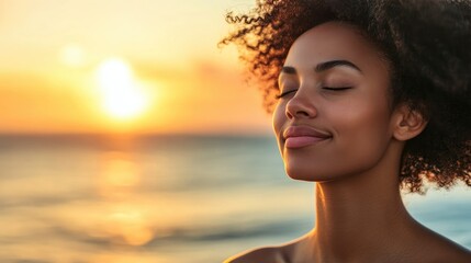 Backlit portrait of a joyful woman with closed eyes enjoying a serene sunset by the ocean, surrounded by warm orange and golden hues.