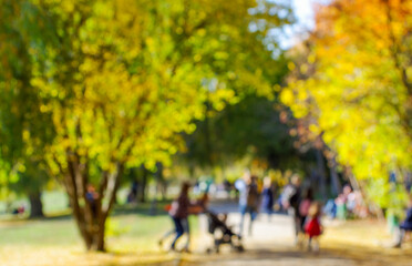 Blurred image of people in day in city park background