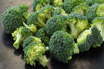 Fresh green broccoli on black background