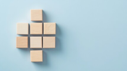 Wooden blocks connected together in a neat arrangement on a blue background, symbolizing teamwork, collaboration, and building something great together.