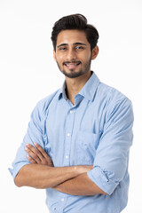 Happy laughing guy posing with arms folded