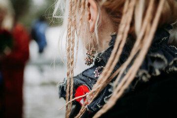 Close-Up of Dreaded Hairstyle with Delicate Earrings