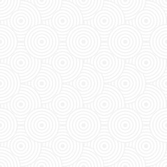 Seamless trend ornament of circles and arcs, geometric white shapes for textiles and wallpaper. Abstract panoramic pattern on a gray background for a New Year or wedding cover or card.