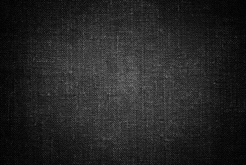 Black canvas texture, shaded black cotton drill fabric texture as background