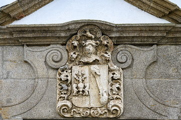 Porto, Portugal, Ancient stone coat of arms with a relief carving style, decorati