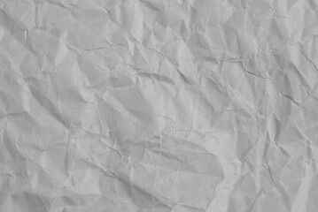 Gray glossy crumpled recycled paper texture as background