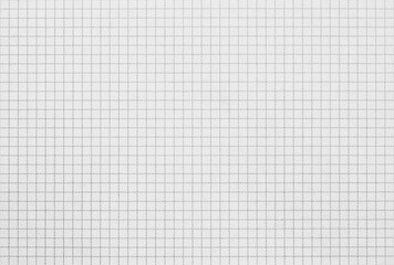 A sheet of math grid paper, gray graph paper texture as background