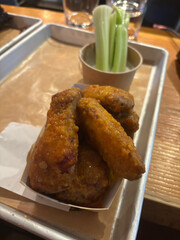 Buffalo Wings with Celery and Dip Sauce served with Tray.