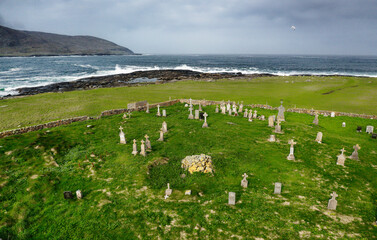 Site of early Christian St. Brendans Chapel with site of Dun Na Cille prehistoric broch behind at Borve, Barra, Outer Hebrides