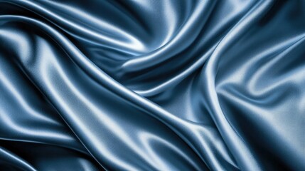 Fototapeta premium Elegant dark blue silk satin background with soft wavy folds, perfect for design applications and providing a luxurious texture.