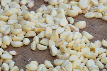 Abstract pattern and shape of pile of peeled Garlic. Garlic for cooking seasoning. Fragrant and fresh aroma. Natural pattern and texture background for graphic design. Related to agricultural and trad