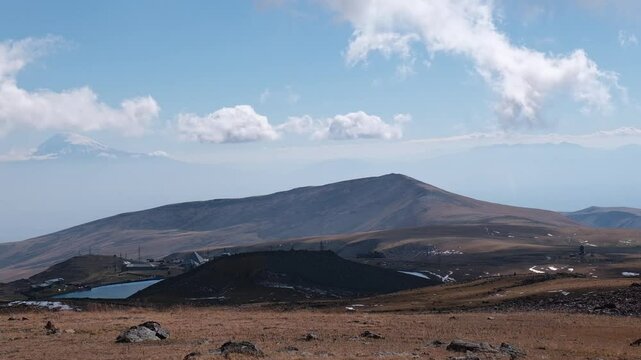 Mountain village near lake Kari nearby Mount Aragats, Armenia. Mount Ararat is in the background