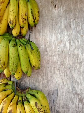 yellowed bananas, hanging ready to be sold