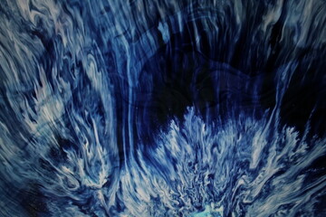 Abstract luxury wavy background, watercolor, alcohol ink painting of a blue gradient from white to navy swirl. Abstract liquid background. Blue liquid colors splashing abstract background wallpaper.
