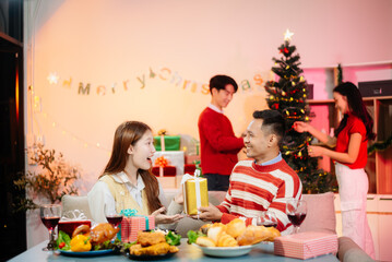 Enjoy the holiday spirit with a joyful Christmas celebration featuring friends, festive food, Santa hats,