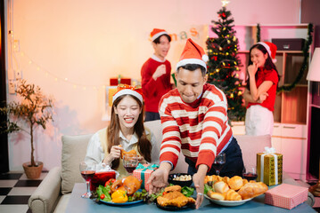 Enjoy the holiday spirit with a joyful Christmas celebration featuring friends, festive food, Santa hats,