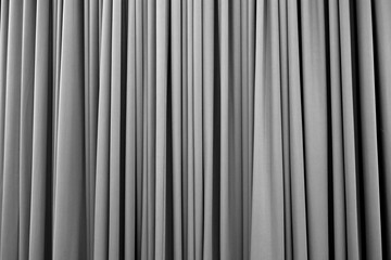 Silver grey curtain with many folds background texture