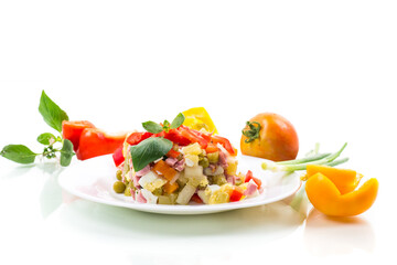 vegetable salad of boiled vegetables, with peas, sausage, sweet pepper.