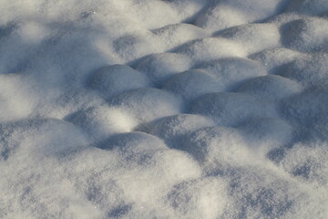 Beautiful snow texture background. Snow winter or christmas background. Snow texture. Winter white background. natural Snowdrift in sunny day. Nature Winter snow texture background.
