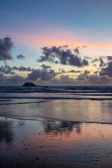 Maori Bay covered with clouds at sunset