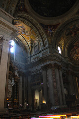 Obraz premium Sunlight piercing through the ornate interior of a Roman Basilica